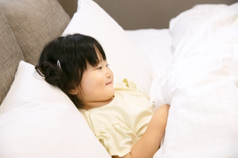 image of a child sleeping in bed