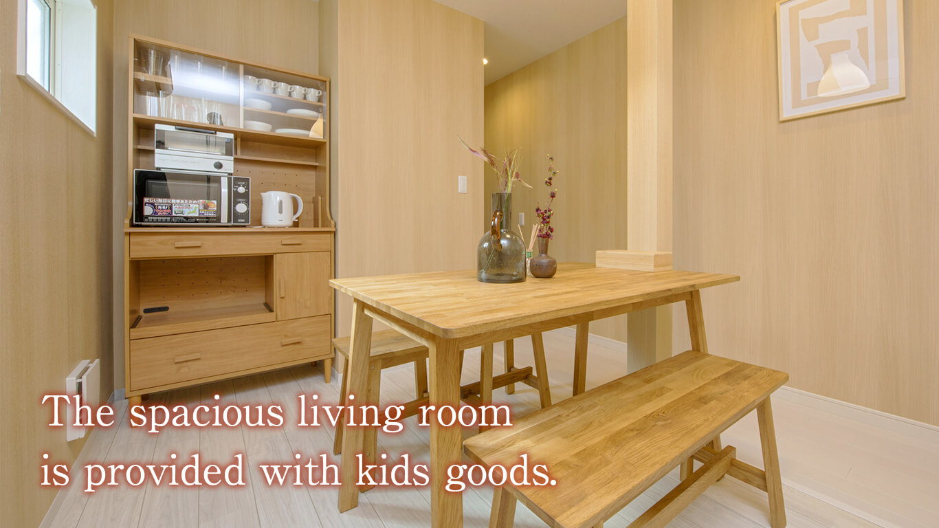 The spacious living room is provided with kids goods.
